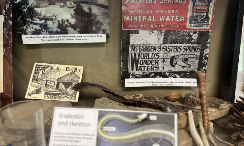 An exhibit inside the visitor center at Lake Ouachita State Park tells more about Three Sisters Springs. 
